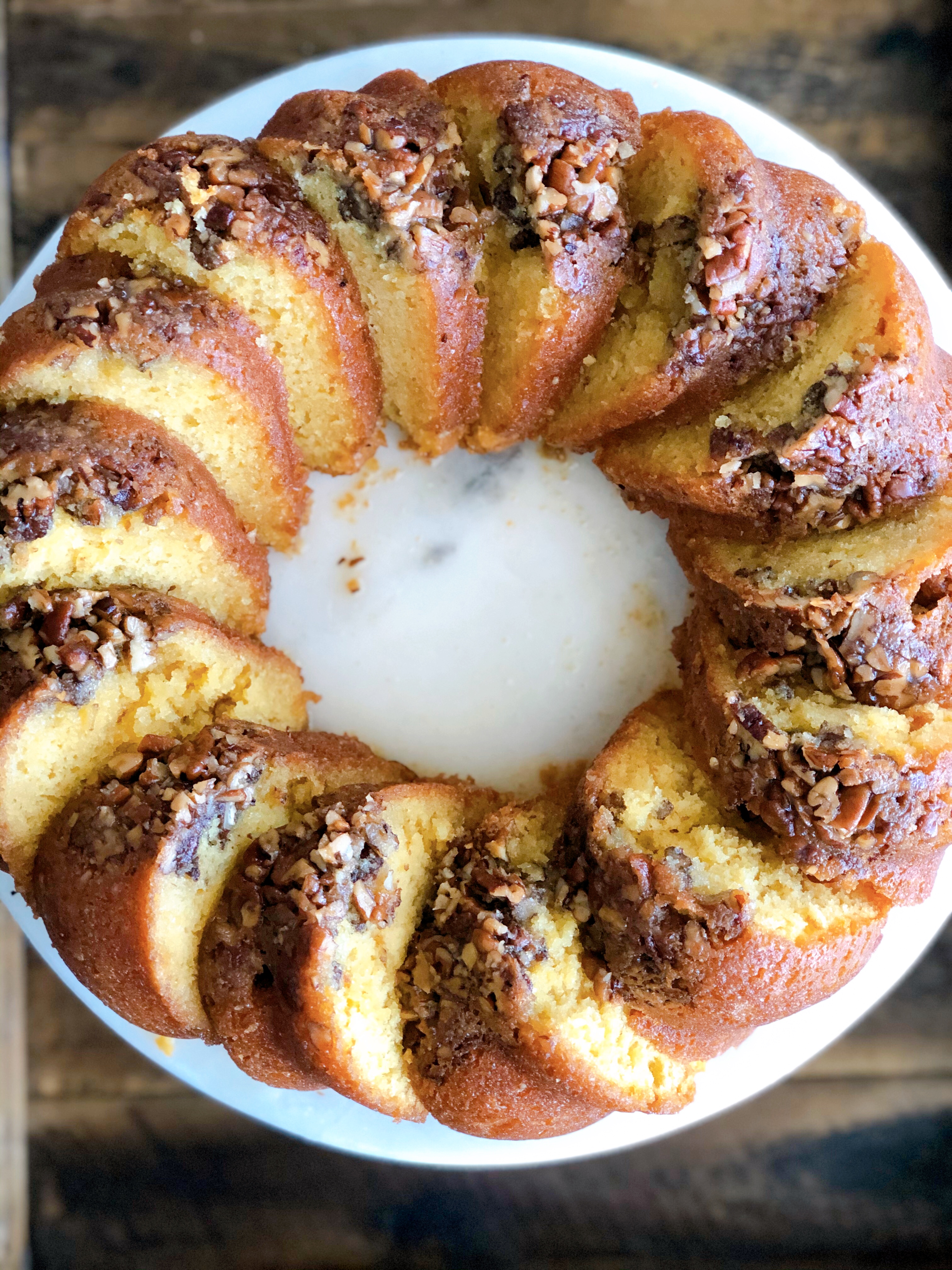 Rum Cake sliced on a white cake plate