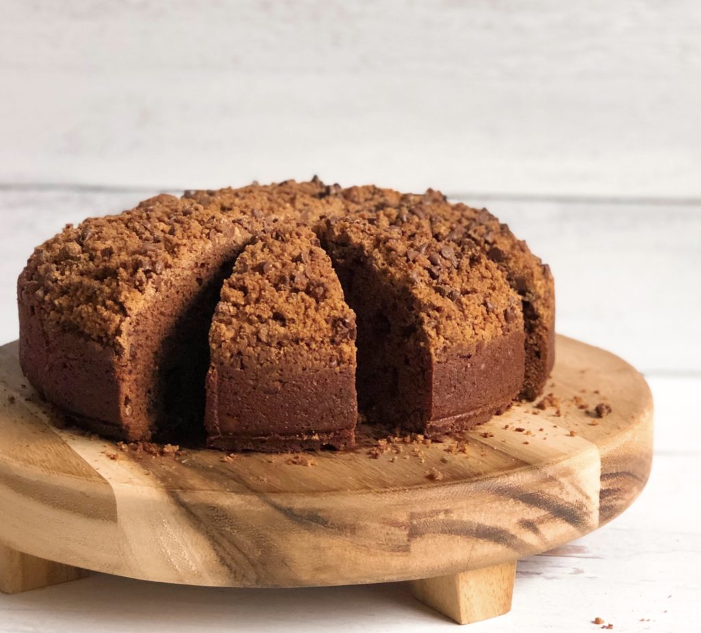 Double Chocolate Coffee Cake cut into slices on a wooden board.