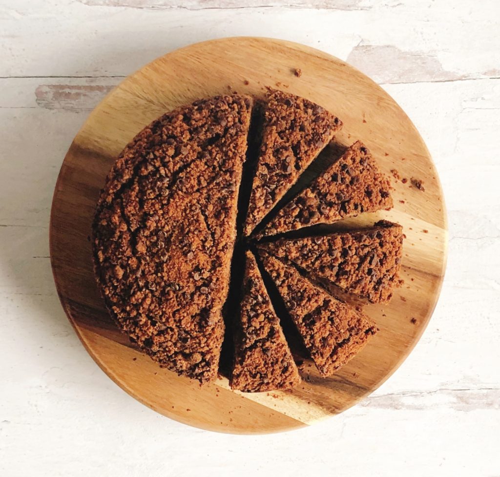 Double Chocolate Coffee Cake cut into slices on a wooden board.