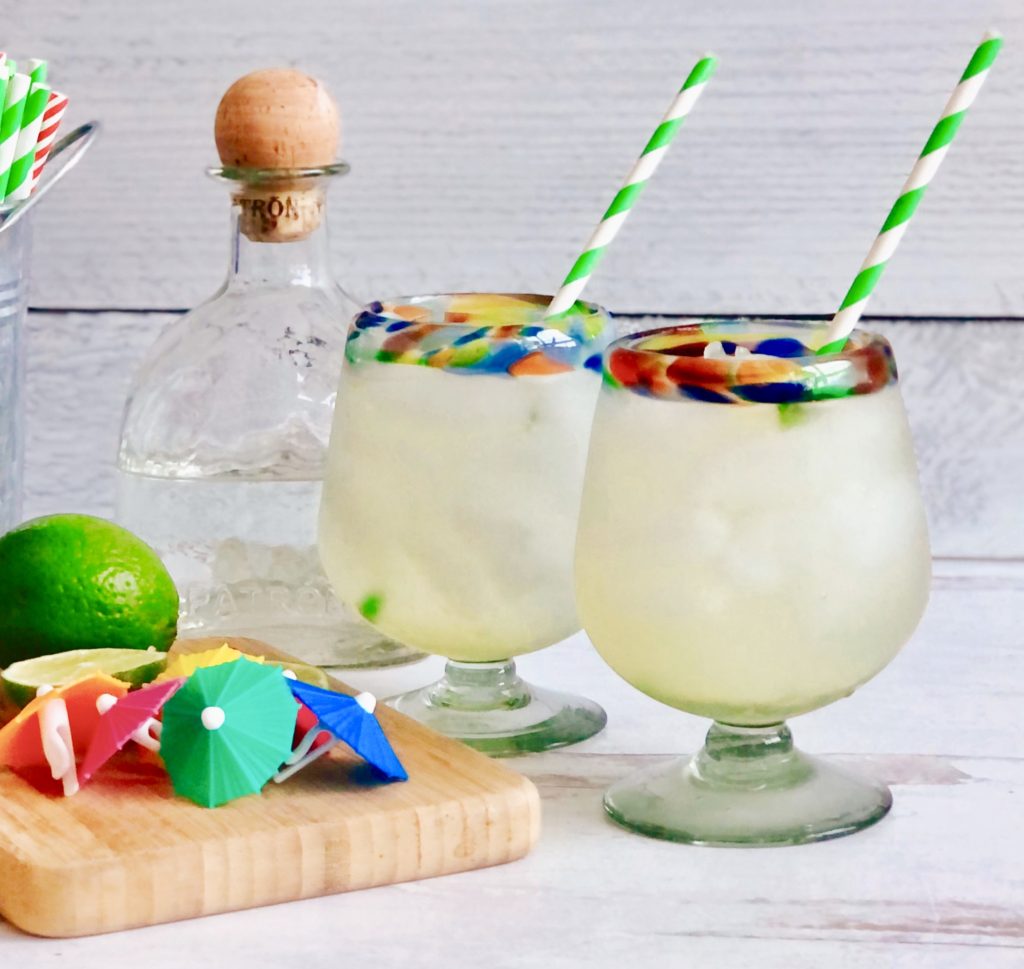 Skinny Ginger Lime Margarita with green and white striped straws