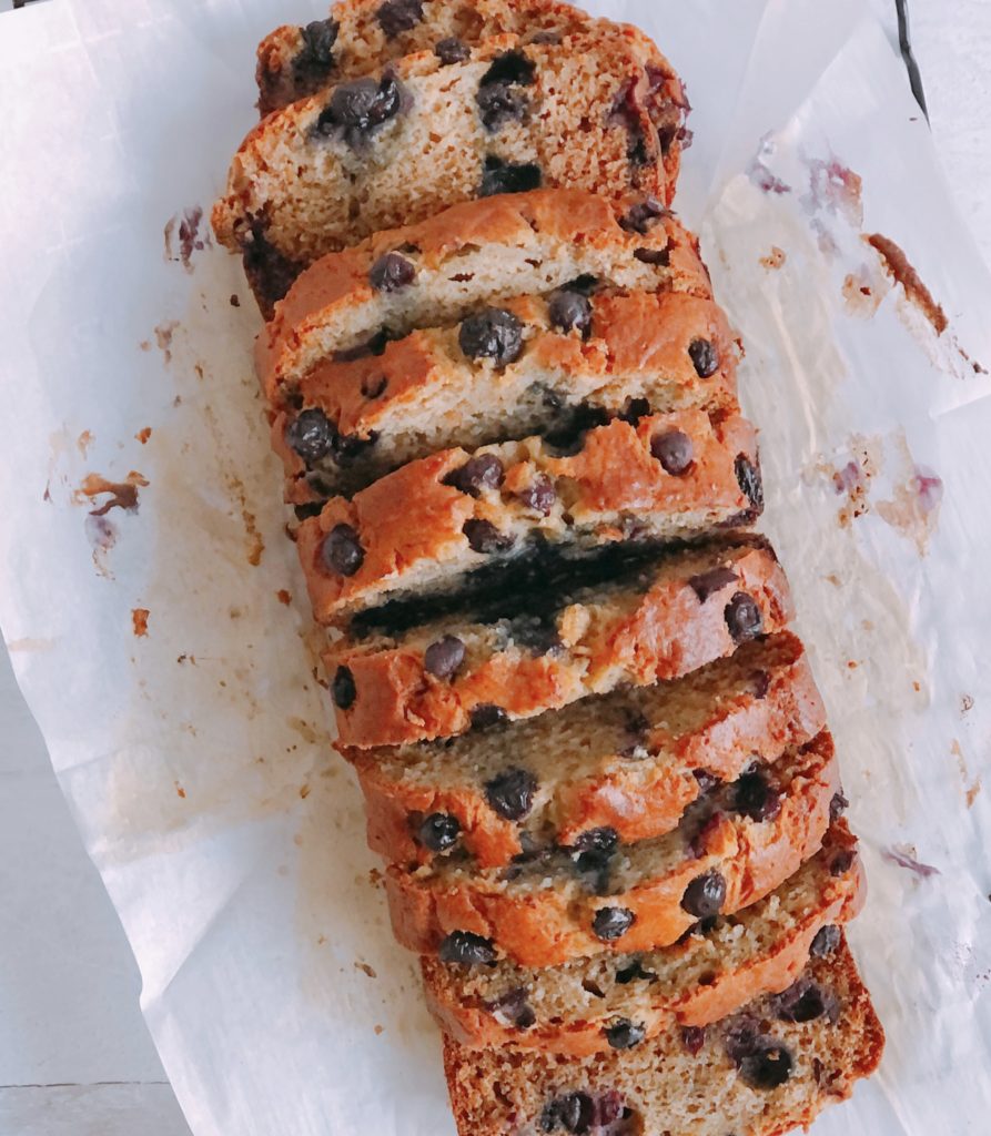Blueberry Banana Bread sliced on parchment paper