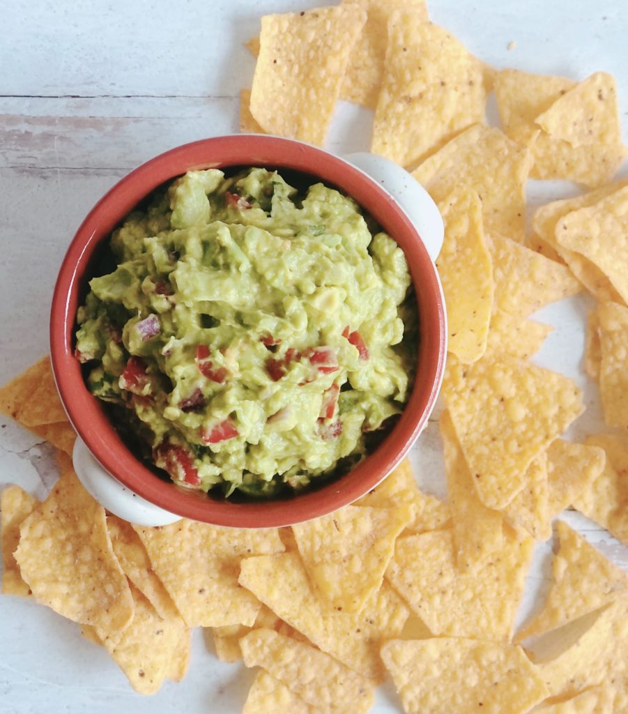 Easy Guacamole in a bowl surrounded by tortilla chips