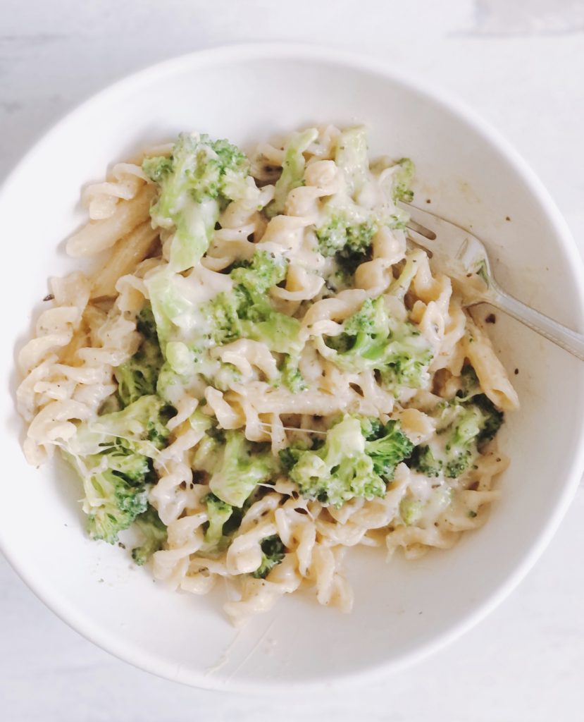 One Pot Broccoli Alfredo in white bowl with fork