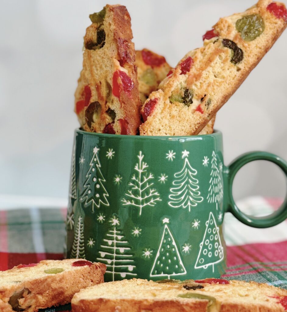 Candied Cherry Biscotti in a Green mug with Christmas Trees