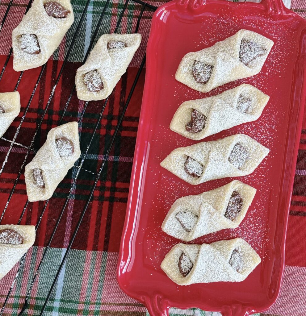 Italian Pinch Cookies on a red dish.